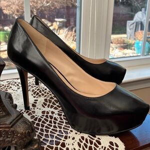 Nine West Black Leather Platform Stiletto Pumps that gives you height.